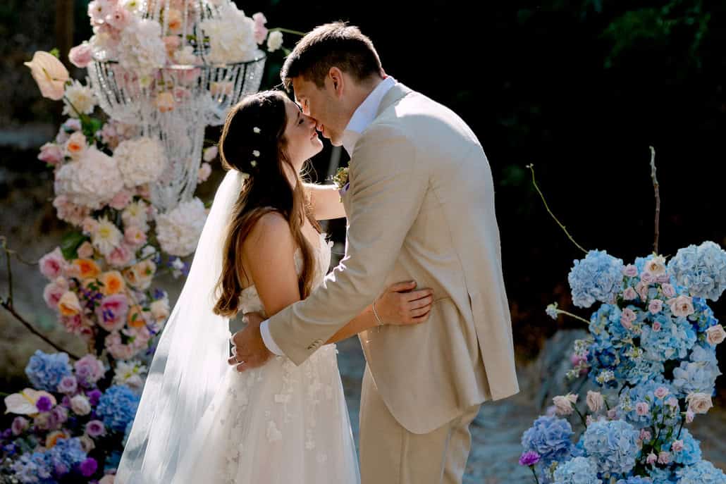 Pastel colored wedding ceremony on a stone bridge at Casale Panayiotis | Rebecca & Dimitris
