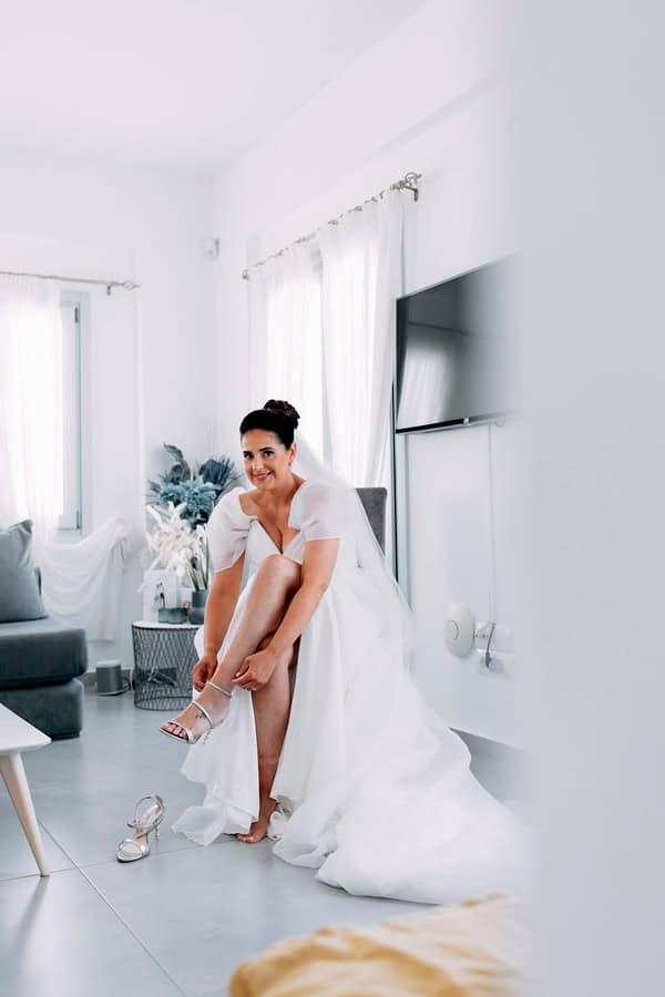 Summer Wedding In Oia With A Lush Floral Arch
