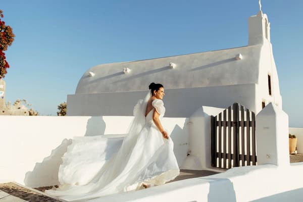 Summer Wedding In Oia With A Lush Floral Arch