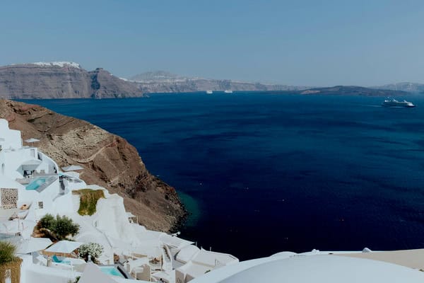Summer Wedding In Oia With A Lush Floral Arch