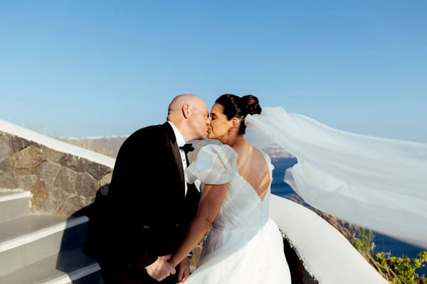 Summer Wedding In Oia With A Lush Floral Arch