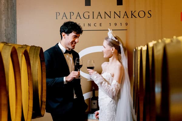 Elegant styled shoot at a winery with romantic red florals