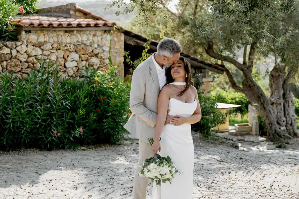 A wedding in Crete with white blooms and a heartwarming ambience | Eleni & Ben