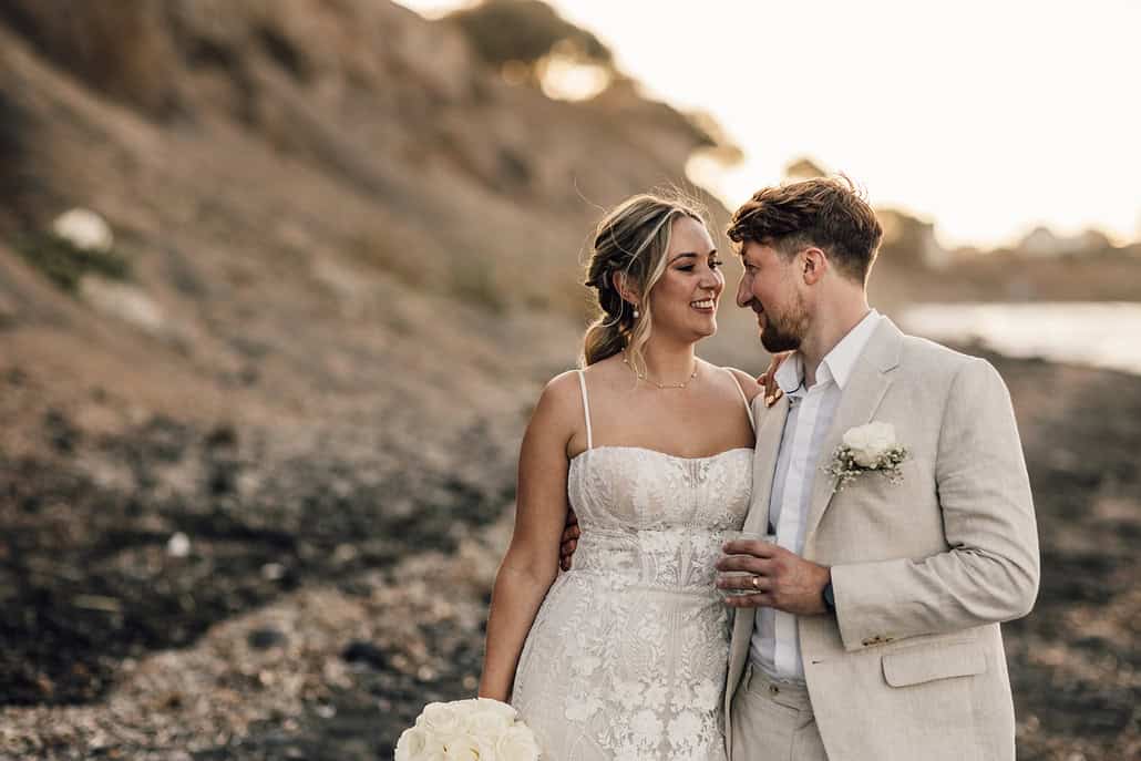 A serene Santorini wedding filled with roses and heartfelt touches | Emily & Tom
