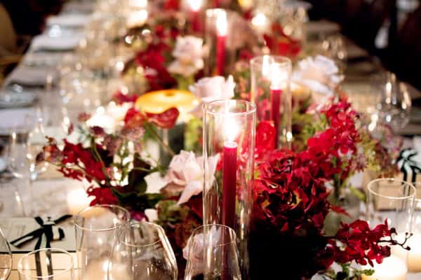 Chic wedding decoration inspiration with luxurious details and bold red blooms