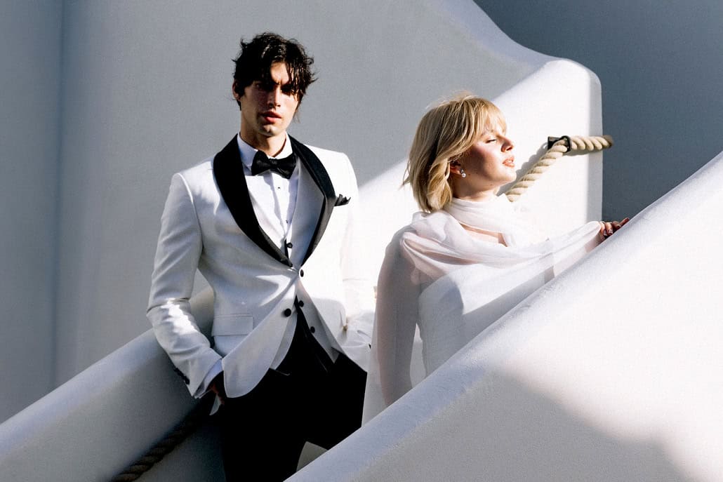 A white tuxedo by Carlitos makes a striking statement for the modern groom