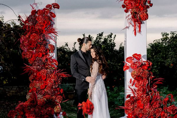 Edgy meets modern in a styled shoot in Crete with dramatic red florals