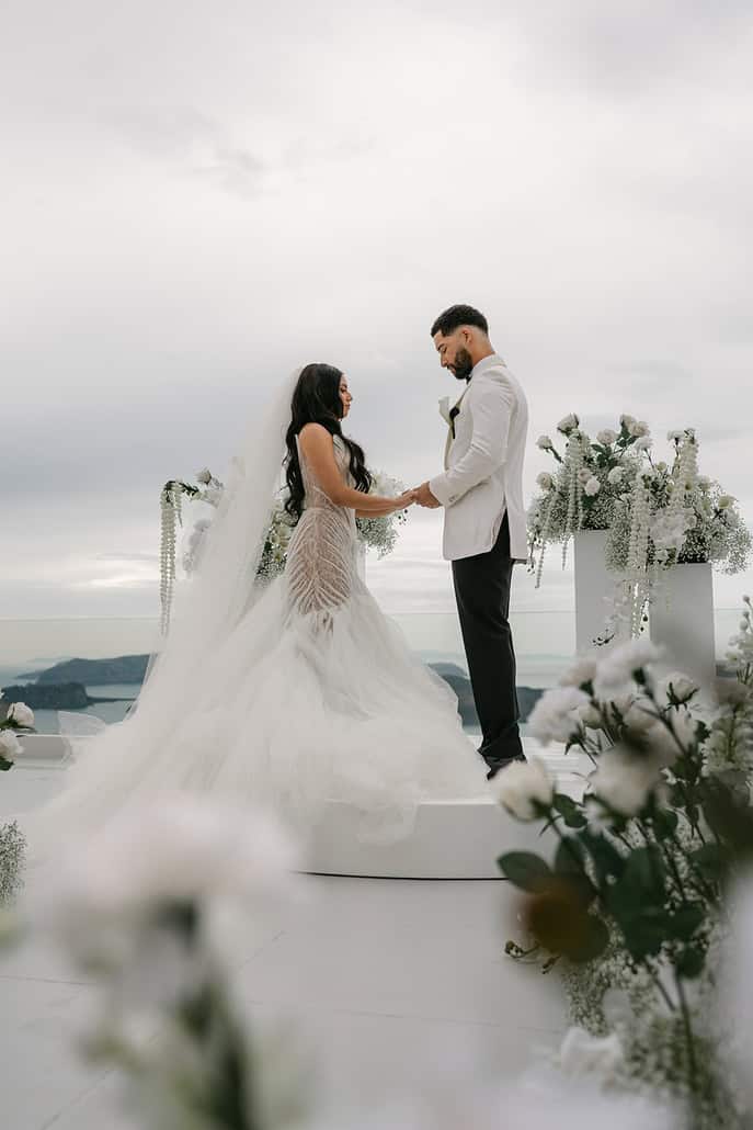 Stylish spring wedding in Santorini with breathtaking caldera views | Kelly & Abdiel